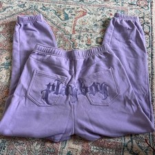 Playboy Pacsun Y2K purple sweatpants withplayboynlettering on the butt