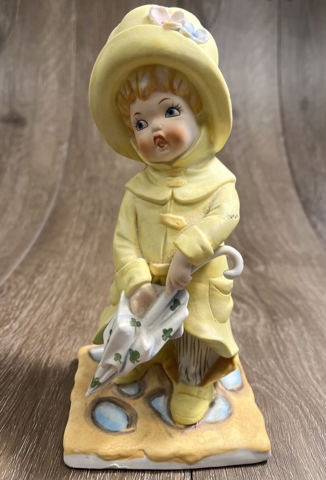 Vintage 1971 Porcelain Sculpture Boy in Yellow Rain Jacket with Umbrella