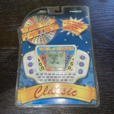 WHEEL OF FORTUNE Tiger Electronics Handheld CLASSIC 2002 – NEW FACTORY SEALED