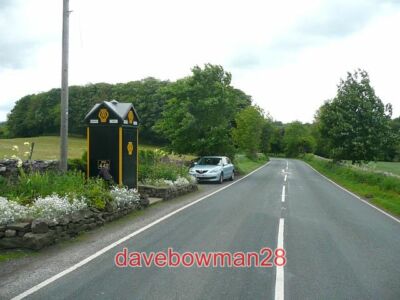PHOTO  THE A684 AND AA BOX WEST BURTON THE AA BOX HAS A WELL-KEPT GARDEN ON EACH