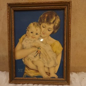 Mother Baby holding Rattle or toy  by Charlotte Becker