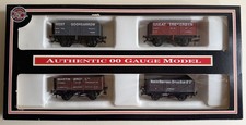 Dapol OO Scale Set of  4  7 Plank Open wagons in Cornish China Clay liveries.