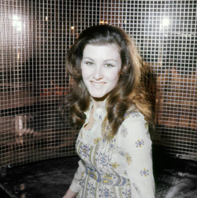 Actress singer Lee Gibson poses against a mirrored backdrop London- Old Photo