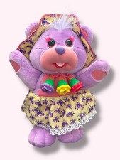 Vintage 1995 KISS' EMS Purple Plush wearing hat and skirt. Canada Games Company.