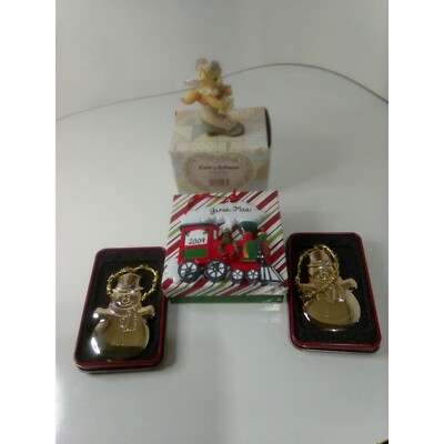 4 Different Christmas ornaments 2 snowmen a train and a cat in a shoe