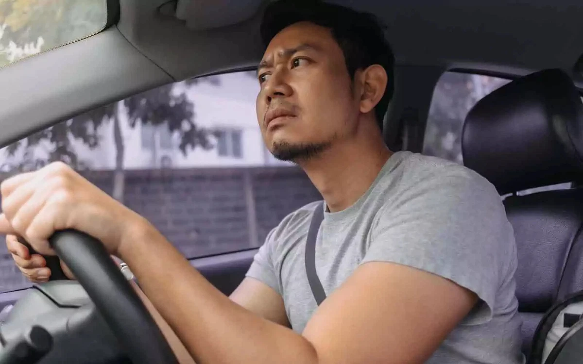A driver hears something odd coming from the engine compartment.