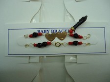 BABY BRACELET WITH BLACK AZABACHE HAND  BRANDNEW  ..
