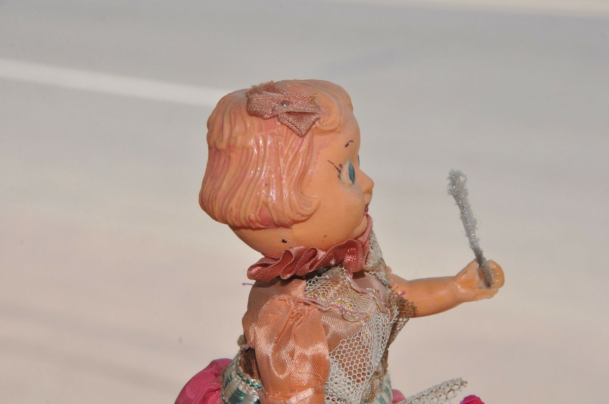 Vintage Wind Up Doll With Stick & Flower Litho Tin Toy
