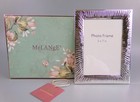 Silver Plated Photo Frame by Melange. Boxed. 5" x 7" photographs. Free standing.