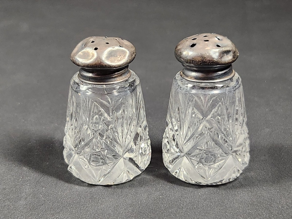 Antique cut crystal salt and pepper shakers sterling silver tops