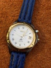 Montre Seiko Kinetic SQ50 date acier doré quartz automatique 32mm