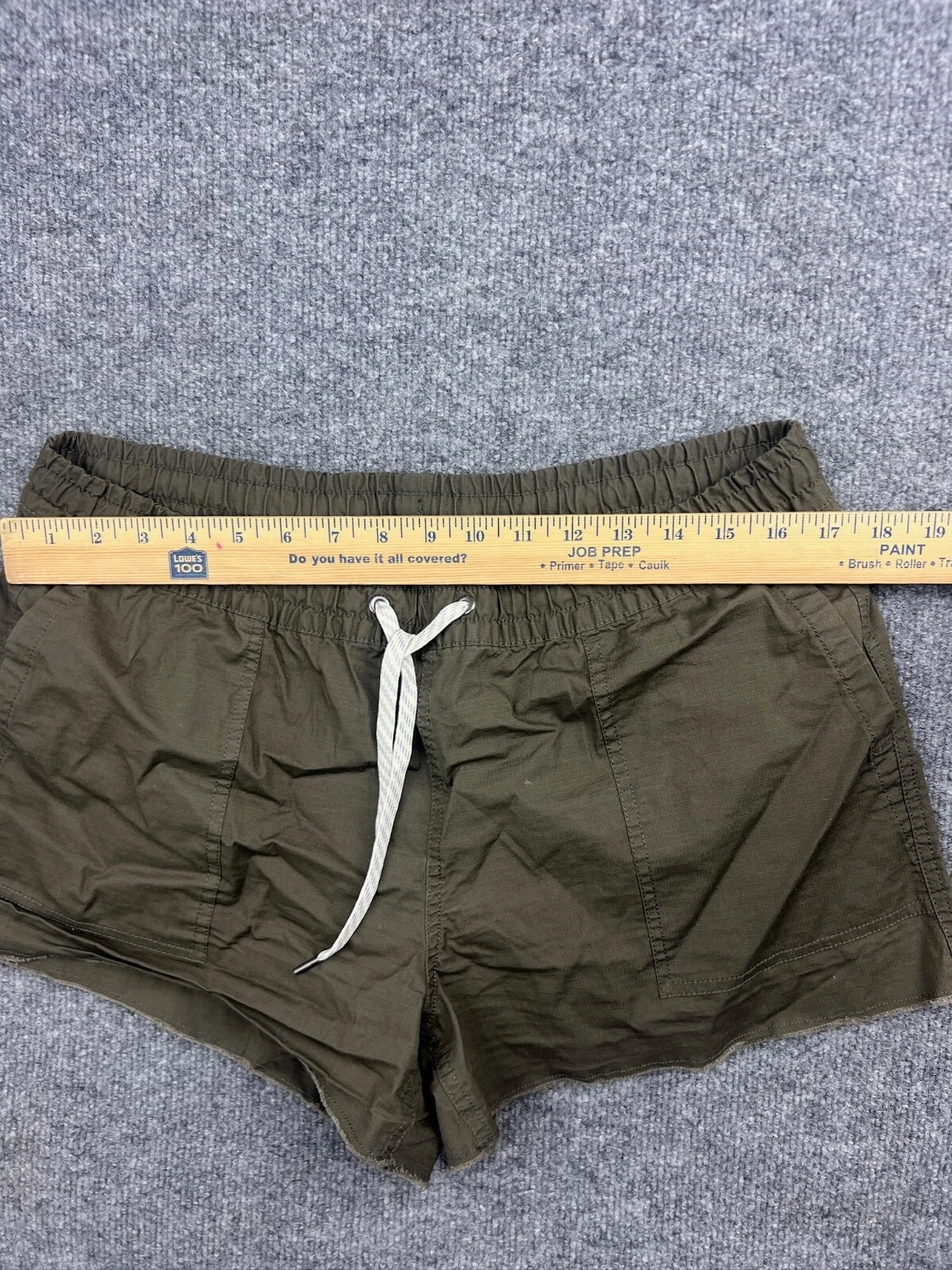 vuori drawstring elastic waist pockets raw hem zip pocket shorts