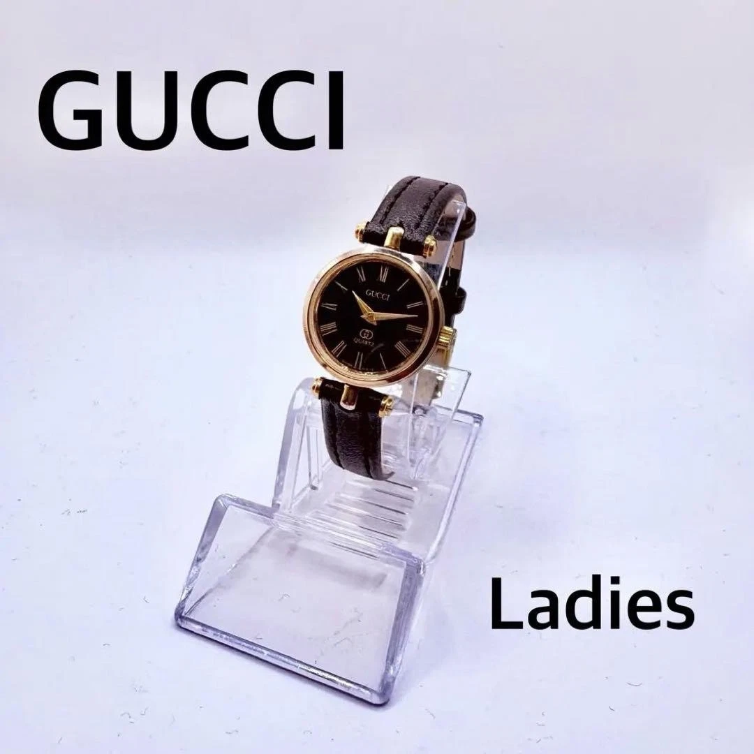 Montre femme GUCCI GQ2000 bracelet cuir noir doré occasion excellent état