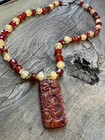 Handcrafted beaded necklace featuring a Chinese carving pendant — photo 1
