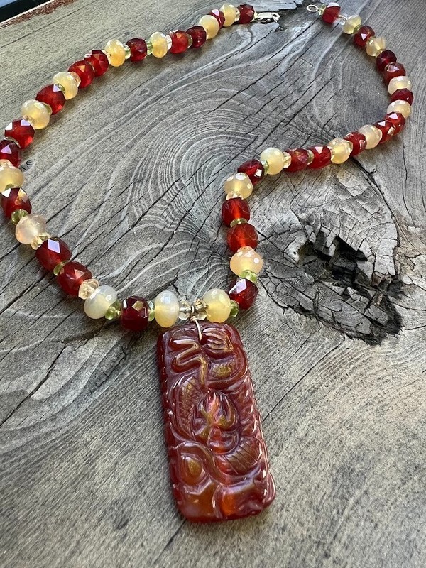Handcrafted beaded necklace featuring a Chinese carving pendant