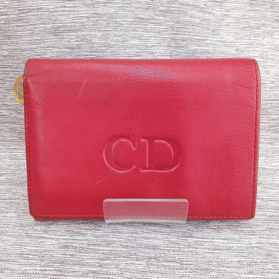 Portefeuille Christian Dior vintage logo CD cuir rouge double pli fabriqué en Espagne occasion