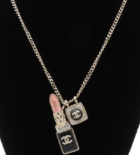 Collana lunga CHANEL CocoMark ciondolo labbra A22C oro metallo resina GP collana donna