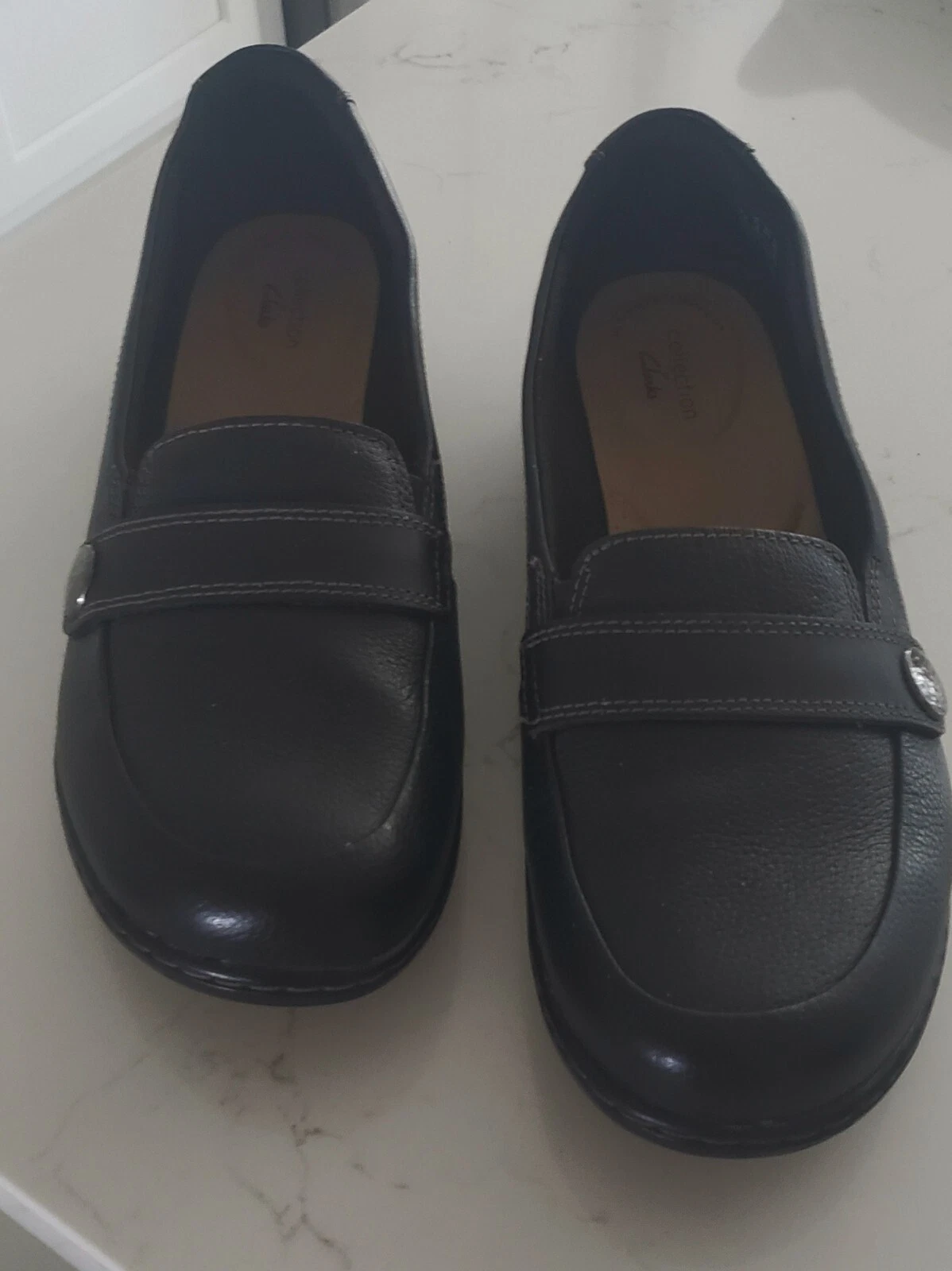 Mocassino Clarks Cora margherita slip on nero in pelle ruvida 10 M