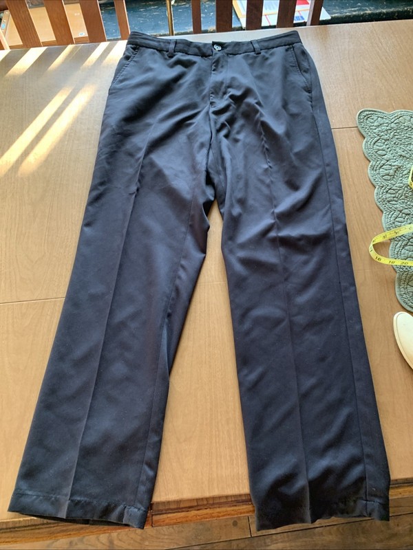 GREG NORMAN GOLF PANTS 34x32 BLACK METAL LOGO “ THE SHARK” NEW SALESMAN SAMPLE