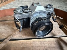 Canon AT-1 SLR Film Camera Black Silver with 50mm Lens, Strap, and Carry Bag