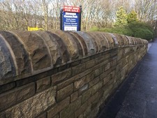 Half round buff to grey Yorkstone  coping stone 