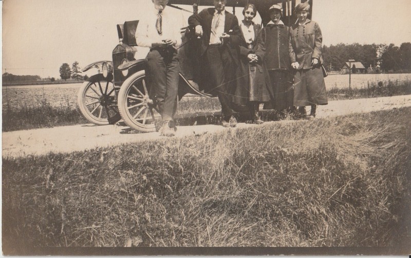 RPPC Group of people standing in front of a Model T