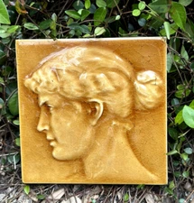 AMERICAN ENCAUSTIC ART POTTERY 6" TILE WITH RELIEF PORTRAIT OF A WOMAN