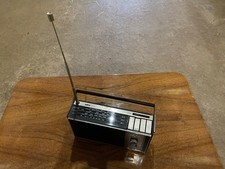 Vintage Ultra Juno portable radio, wood effect sides, carrying handle no leads