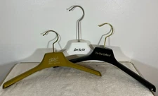 1 Plastic coat hanger - wide shoulders perfect for fur coats jackets black gold