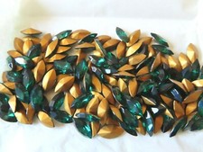 36 Swarovski Navettes In 15x7mm Emerald Gold Foiled. 42002 36 Swarovski Navettes In 15x7mm Emerald Gold Foiled. 42002