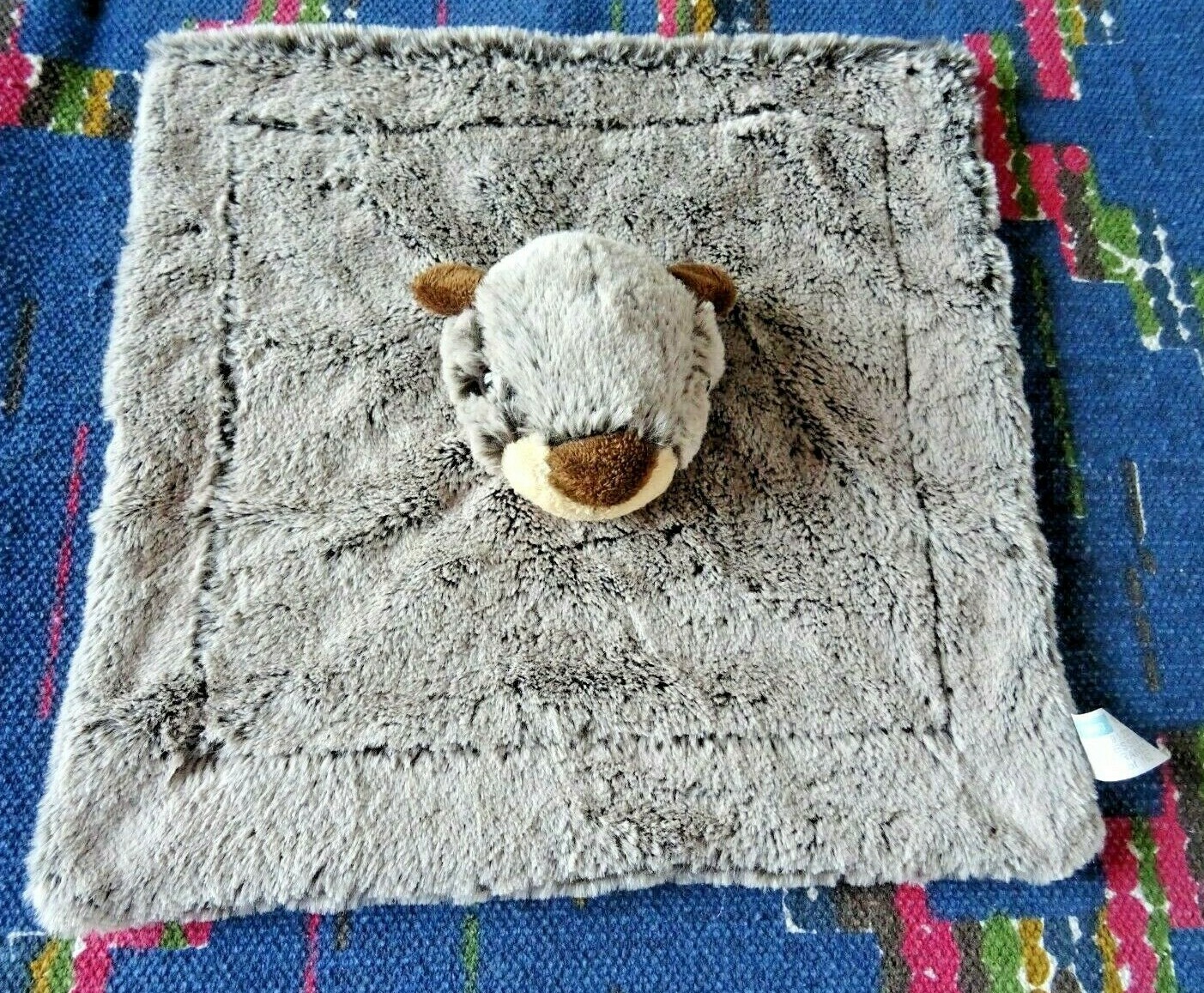 Doudou plat marmotte Kom Neuf un tendre complice marron chiné pour la vie