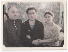 Hand tinted Family Handsome young man boy Carpet backdrop Soviet interior photo