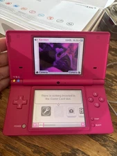 Nintendo DSI Fuscia Handheld Video Game System, charger, box & 6 games