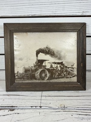 Angles Camp 19th-century steam tractor and agricultural combine in a field