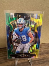 2025 Panini Select Isaac Teslaa #70 (RC) Green & Yellow Shock Prizm Lions