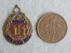 A scarce WW1 era brass and enamel Essex Regiment sweetheart pennant.