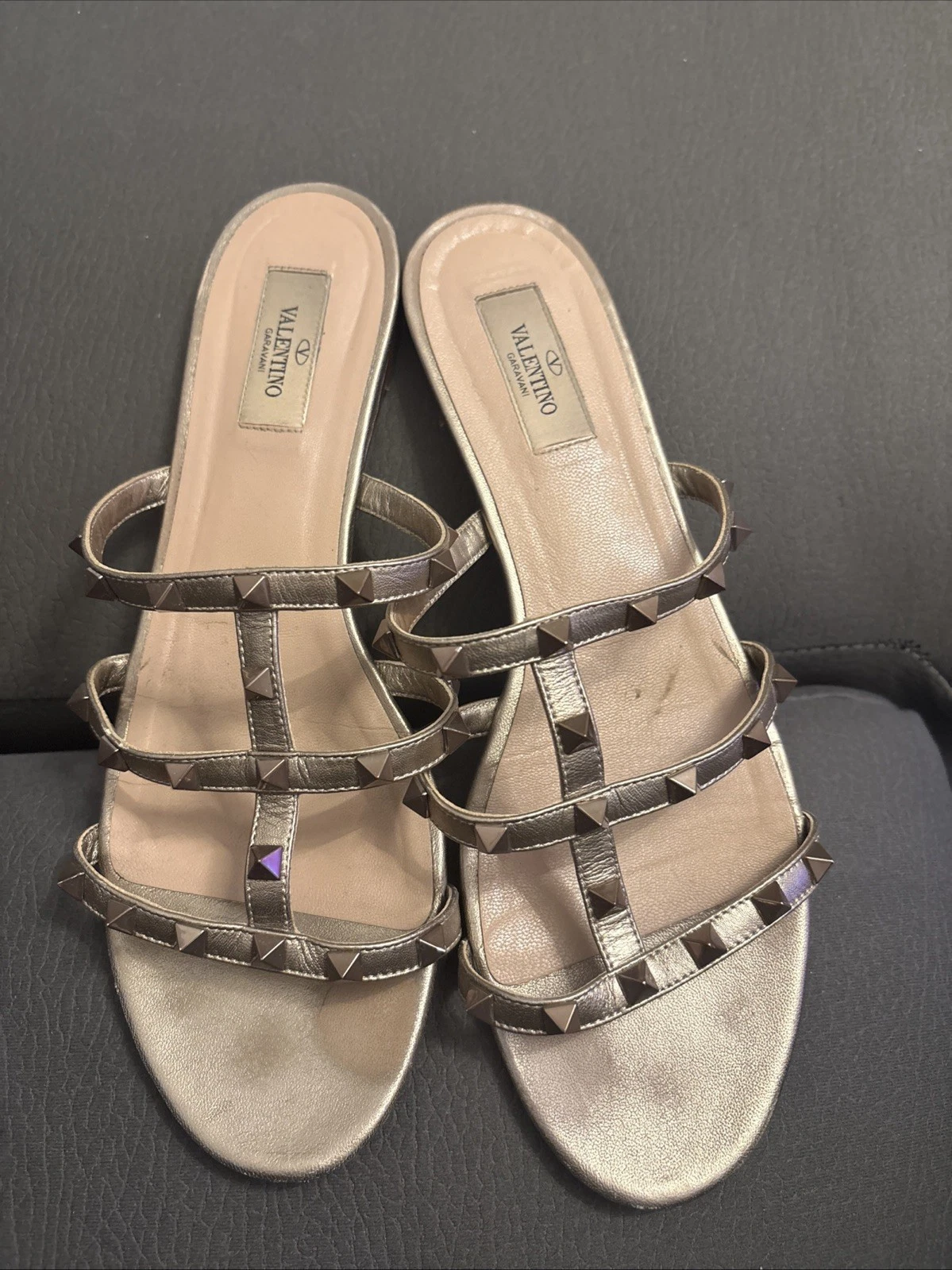 Valentino — Valentino Garavani Rockstud slide sandals in metallic gold leather. Size 41