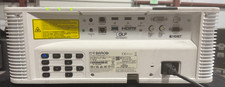 Barco G62-W9 Projector. 9000 Lumens. Lens, remote control, and mounting bracket.