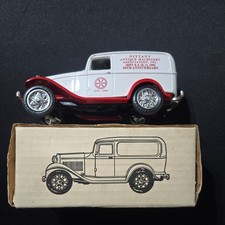Vintage ERTL die-cast coin bank of a 1932 Ford Panel Delivery Truck