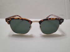 polarized sunglasses with a semi-gold metal-rimmed tortoiseframeandgrey lenses.