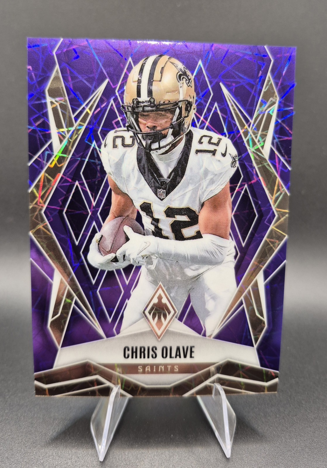 2025 Panini Phoenix Chris Olave #87 Purple Lazer /99 New Orleans Saints