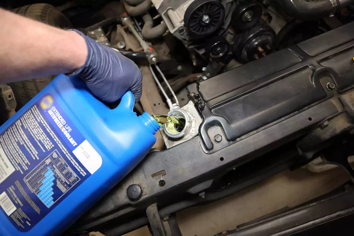 The radiator is refilled with coolant.