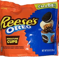 Reese's with OREO Milk Chocolate and White Crème Peanut Butter Cups 9oz In Hand