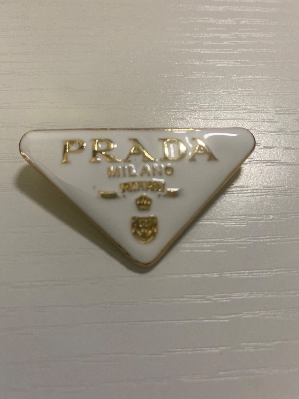 prada brooch pin