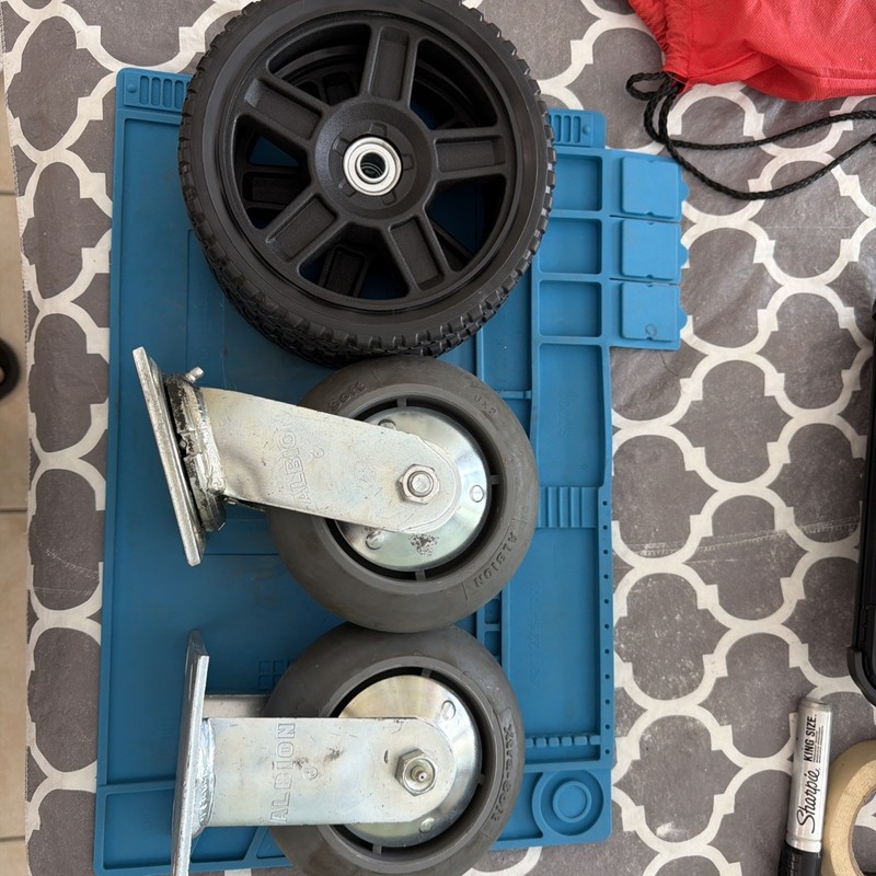 Lot of 4 wheels (2) casters and (2) wheels with bearings all parts new
