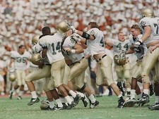 Place kicker Jim Sanson Notre Dame Fighting Irish is mobbed by tea- Old Photo