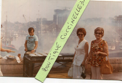 PHOTO OF SARDINES COOKING SARDINES ON BARBECUE AT THE PORT OF LAREDO Spain