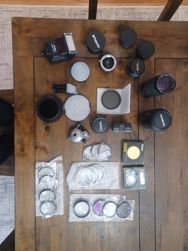Lot of Different Camera Lenses and Other Accessories