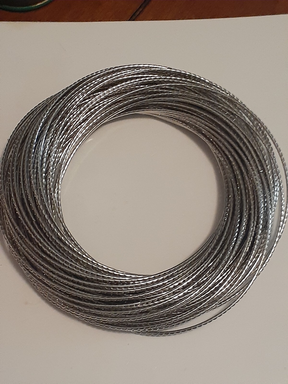 interlocking Silvertone metal bangle bracelets - image 6