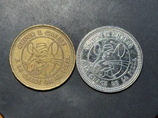 2 Different French Canadian Chuck E Cheese tokens